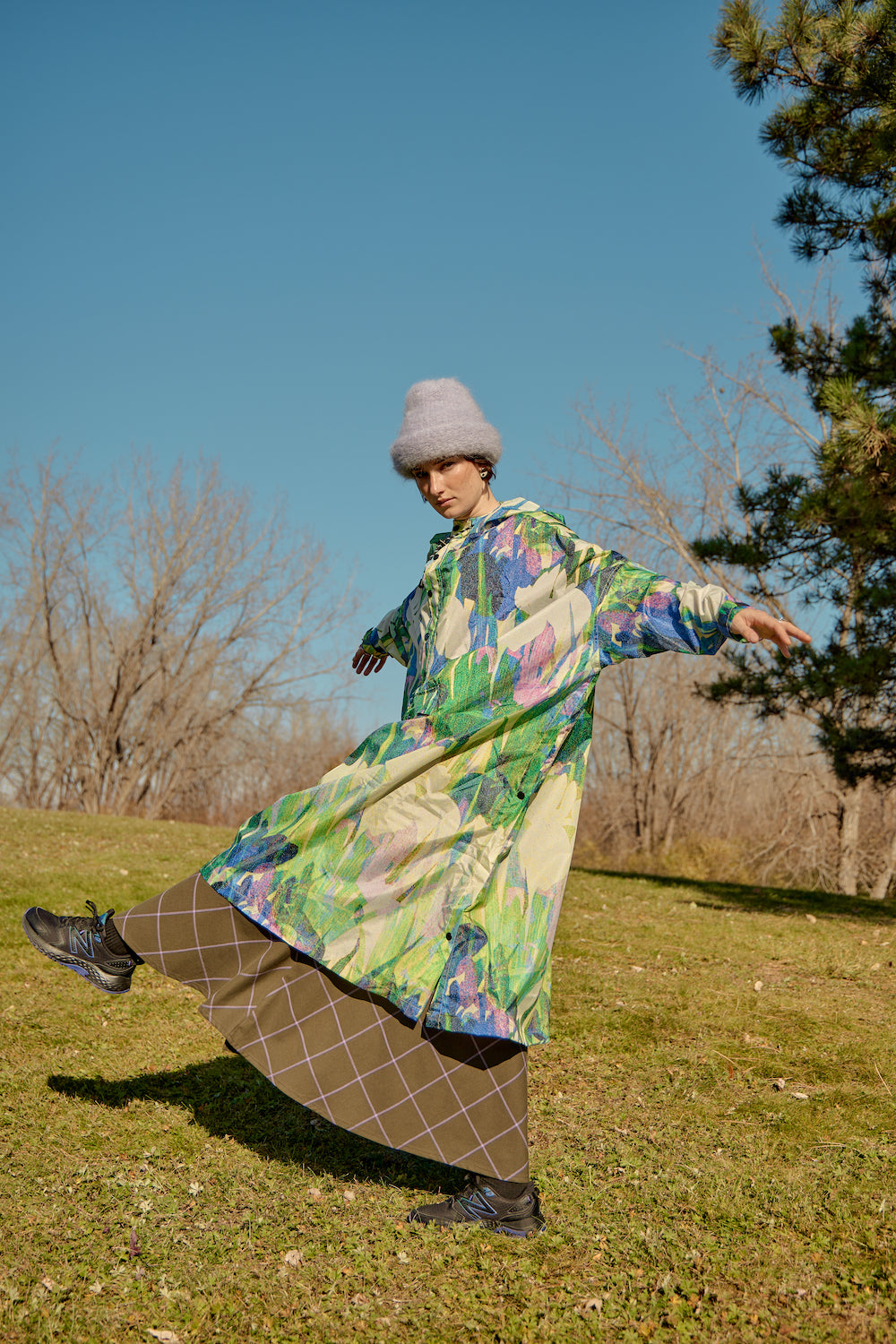 Model wearing a lilac mohair beanie with a pine tree in the background, creating a cozy, nature-inspired vibe.