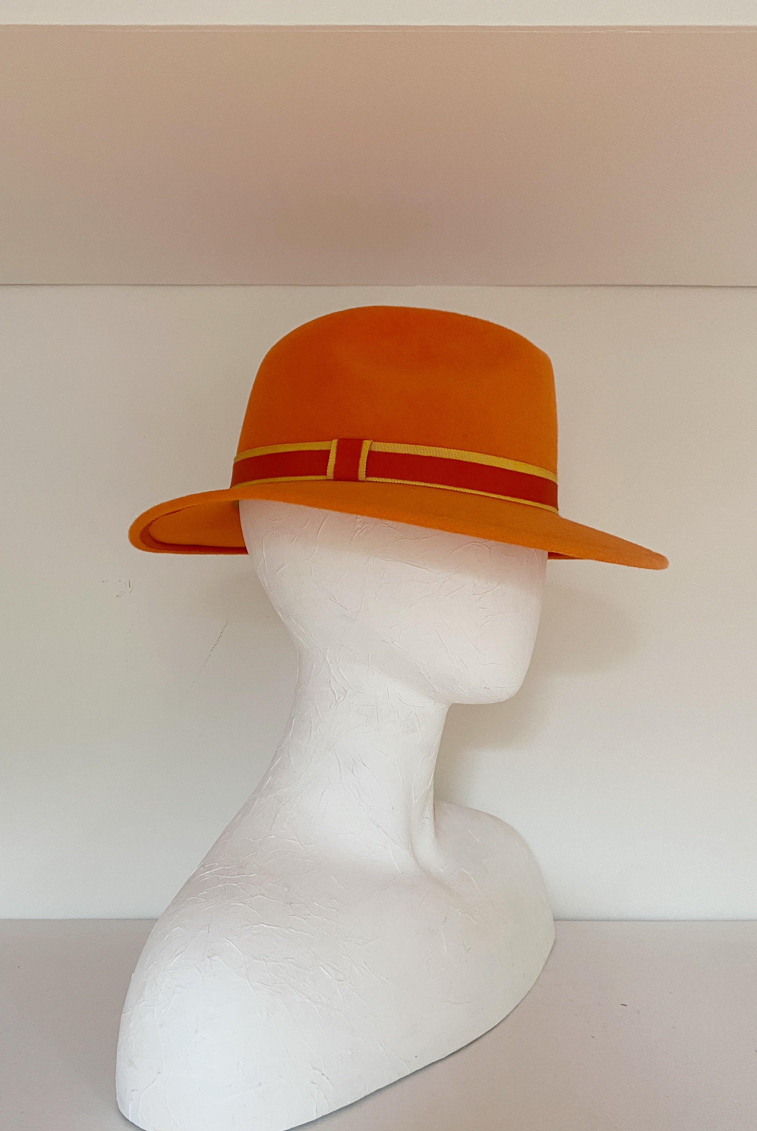 Bright orange fedora with yellow and orange trims (SIZE MEDIUM)