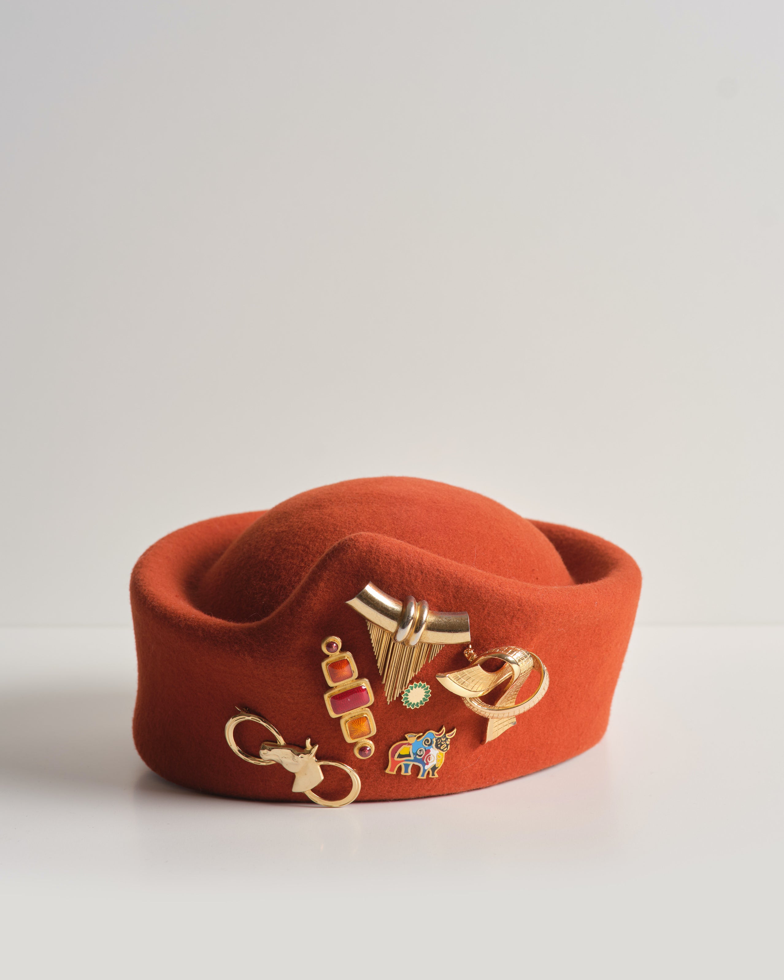 Iberia Ridge – Unisex Brimless Felt Hat in Burnt Orange with Vintage Brooch Cluster | One of a Kind